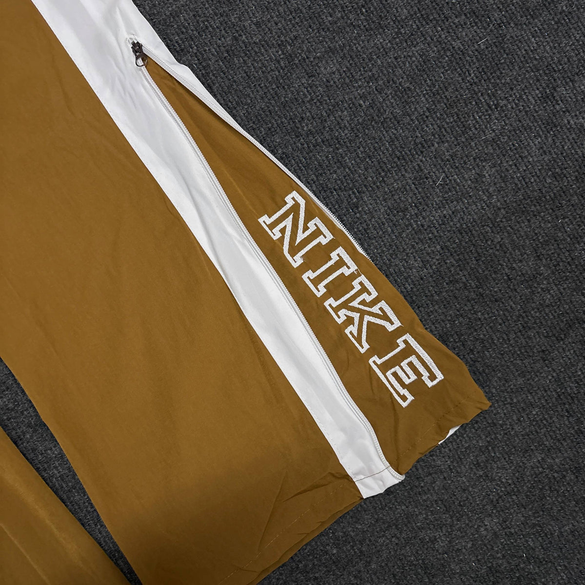 NIKE GOLDEN BROWN TRACK