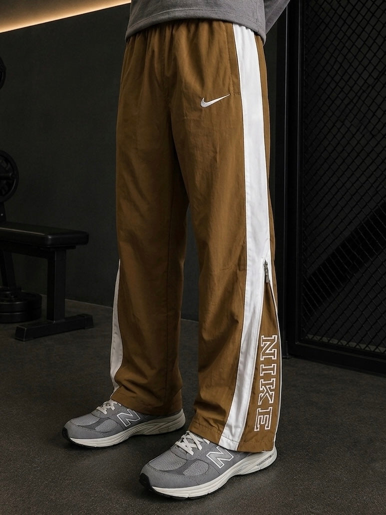 NIKE GOLDEN BROWN TRACK