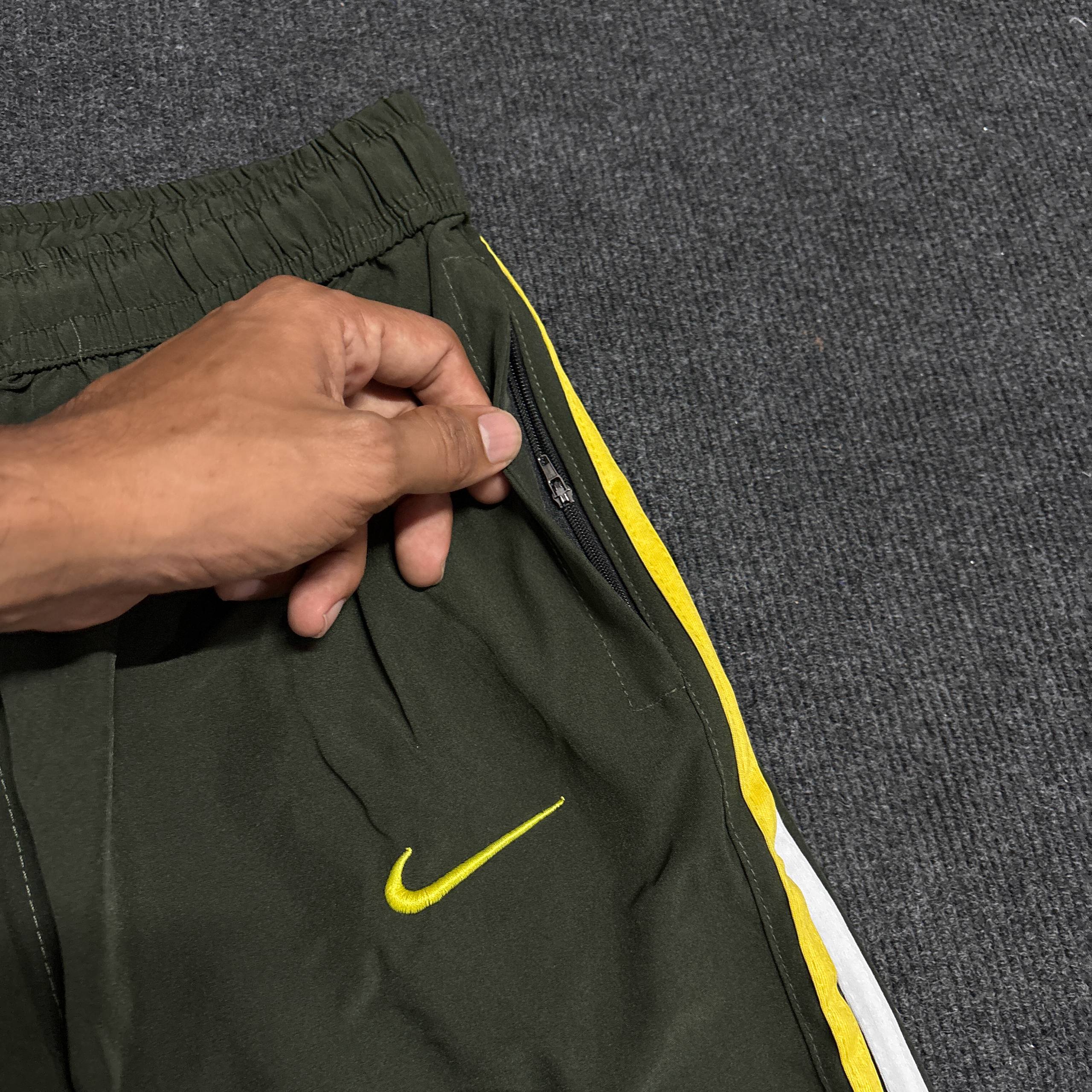 GREEN NIKE TRACK